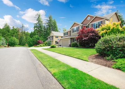 Beautiful American street with walkway and large houses.